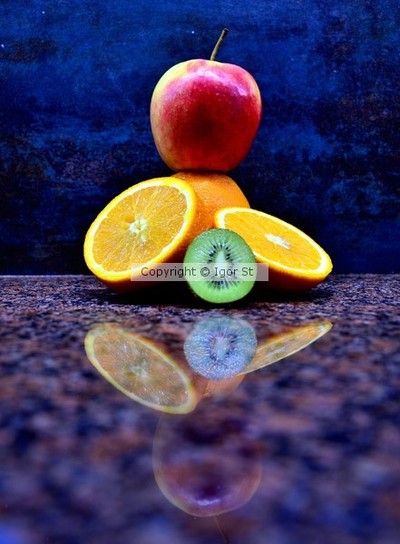 apple, orange, kiwi , table , reflection