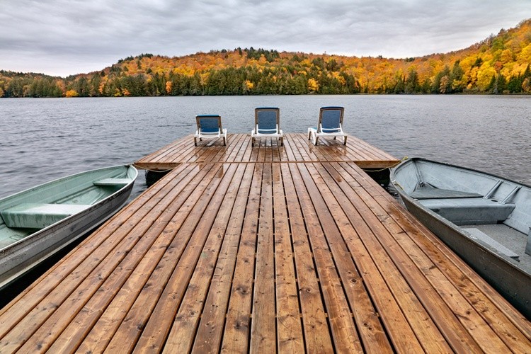 Early morning autumn day overlooking lake from boat dock.