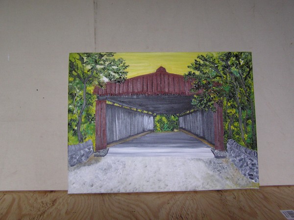 yellow sky over red covered bridge
