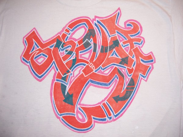 Spin-Off Orange Grafitti Piece Tag T Shirt