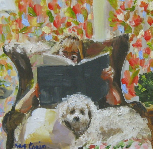woman reading with bichon Dog