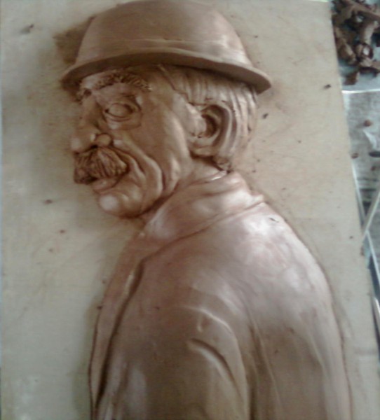 sculpture of 1920's man clay