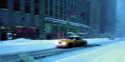 Yellow cab in snow New York
