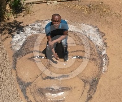 Mandela drawing on Ground with salt and powders