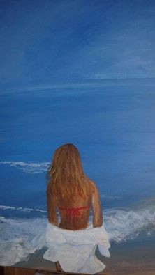 mujer mirando al mar
