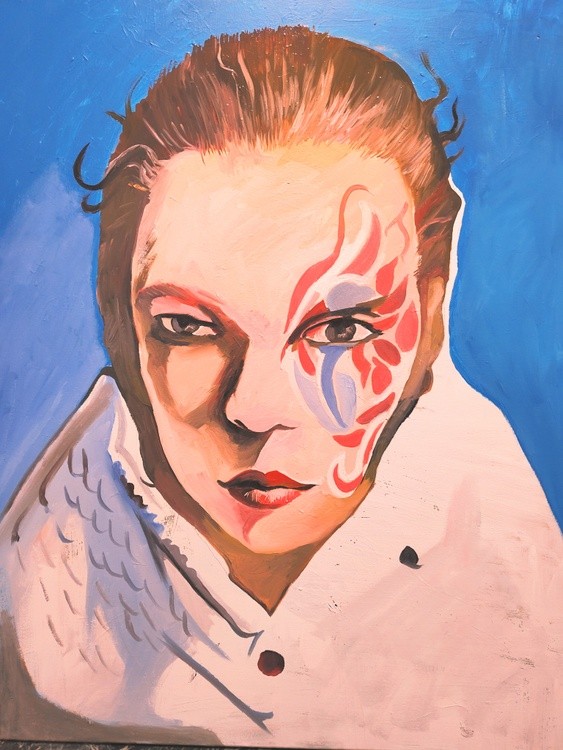 YOUNG WOMAN WITH FACE PAINT