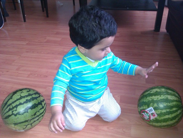 baby with melons