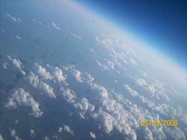 clouds and out line of the earth