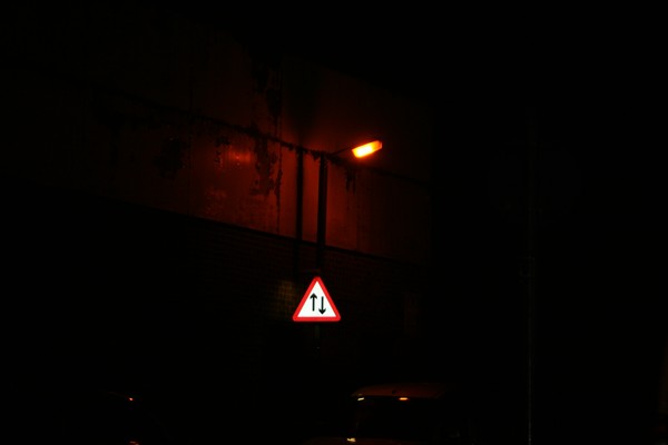 A sign in the dark