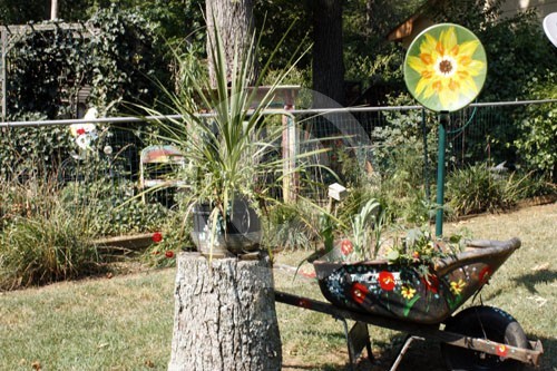 Satellite Flower added to recycled yard art