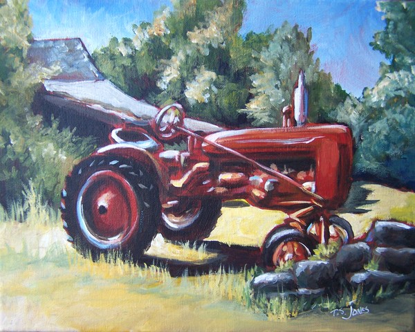 Red tractor and stone wall