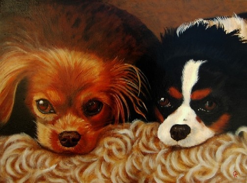 Portrait of two Cavalier King Charles Spaniels.