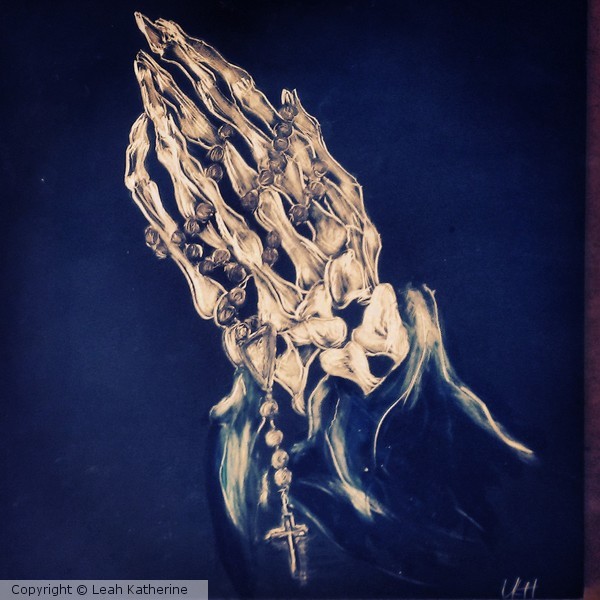 praying hands on scratchboard