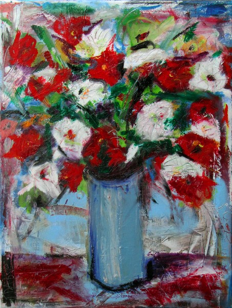 Flowers in tall blue vase