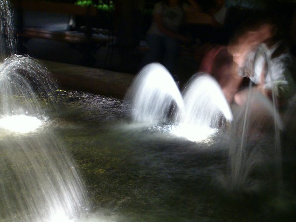 Girl Plays in Fountain