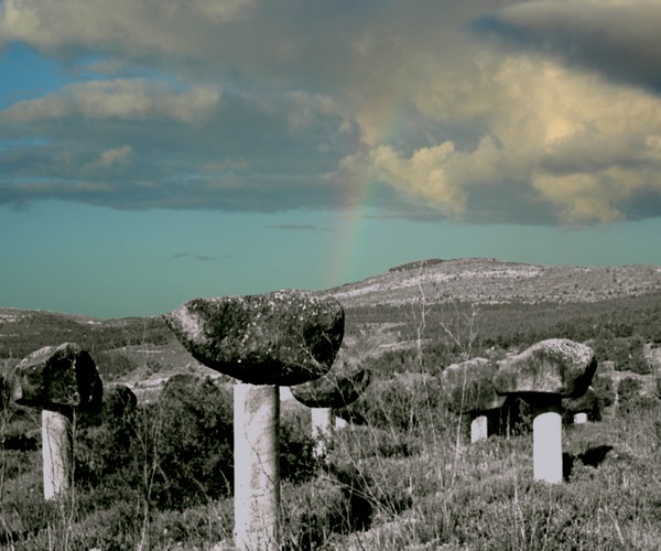 Photomerge mushroom sculture and rainbow