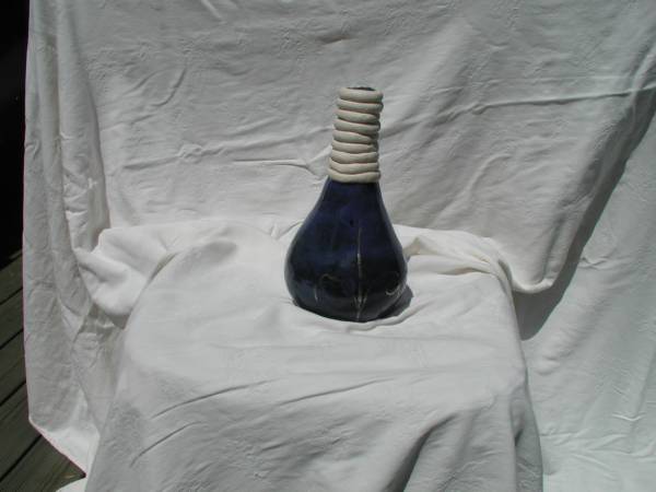 coil built vase in deep blue