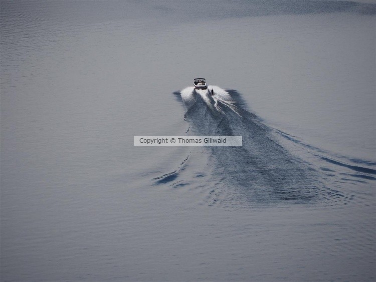 Speedboat with water skier