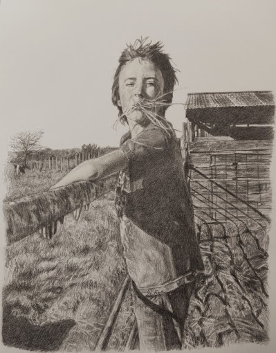 A boy with a hay