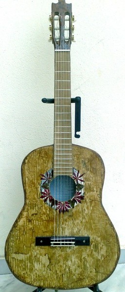 Unique first eco playble guitar from used paper