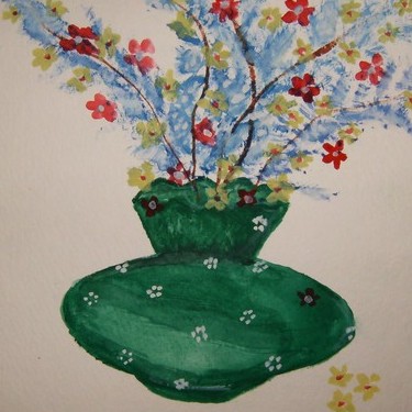 green vase with flowers