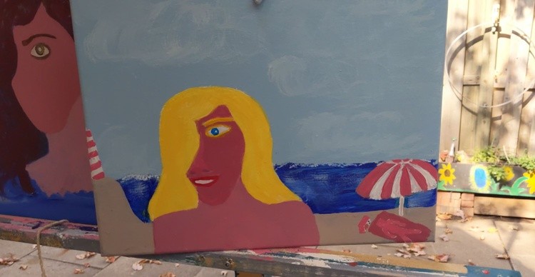 Blonde on a pink beach