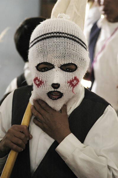 Kid with mask, Accha, Cusco, Peru