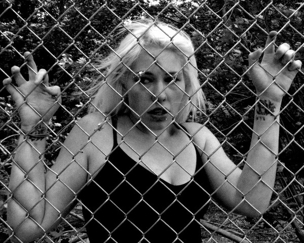 Girl behind fence #1