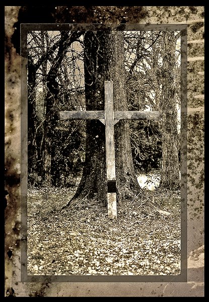 wooden cross in the woods