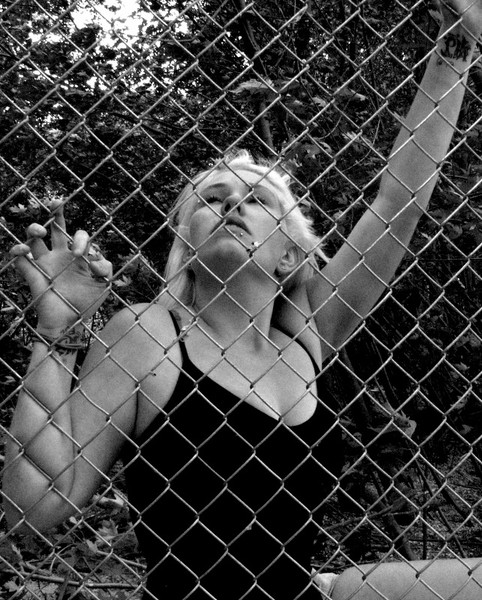 Girl behind fence #2