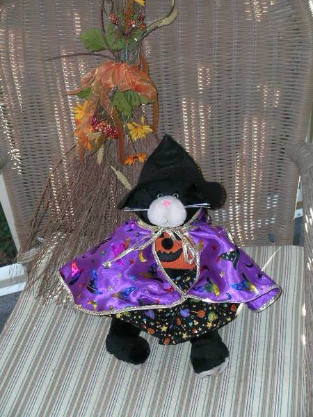Coco's Halloween outfit and broom