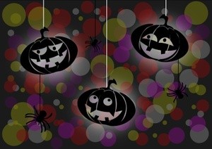 Dark background with three pumpkins  