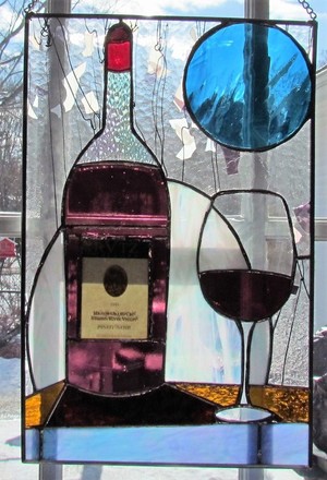 Bottle of wine with glass