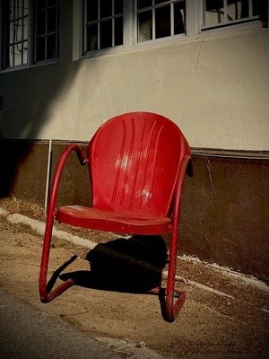 A Red Chair In The Sun