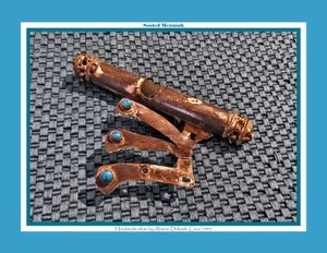 A sooted mezuzah, which was cleaned