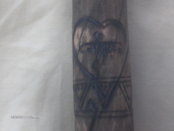 Happy Hearts symbol wood burned