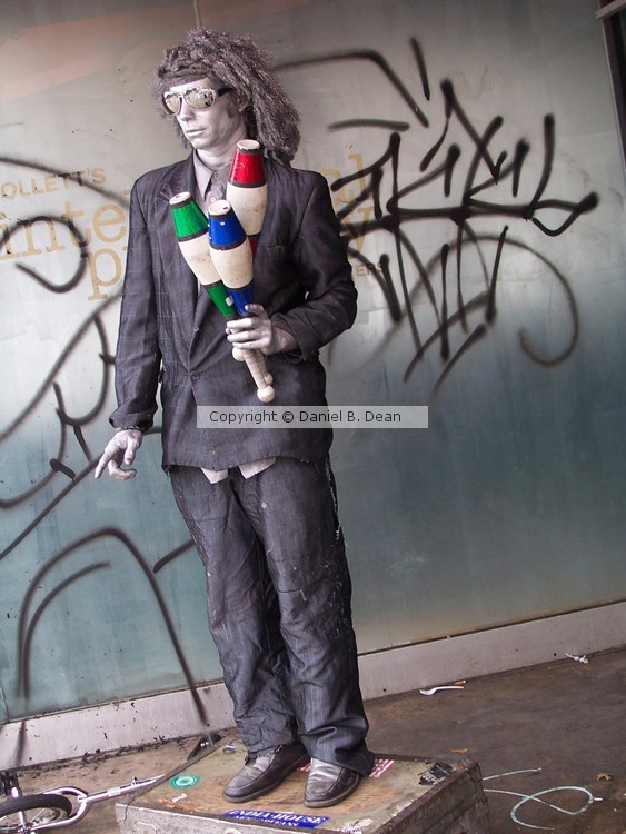Silver Mannequin Jester Street Performer