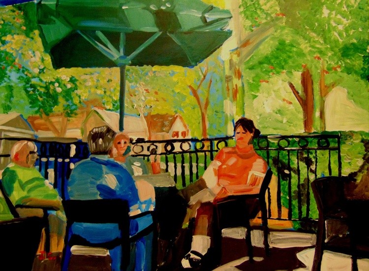 People sitting outside of Cafe