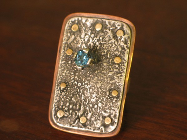 sterling silver, brass, swiss blue topaz ring