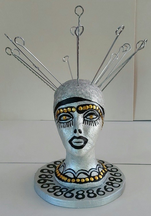 Styrofoam head mannequinn color pencils, gold tacks acrylic painted