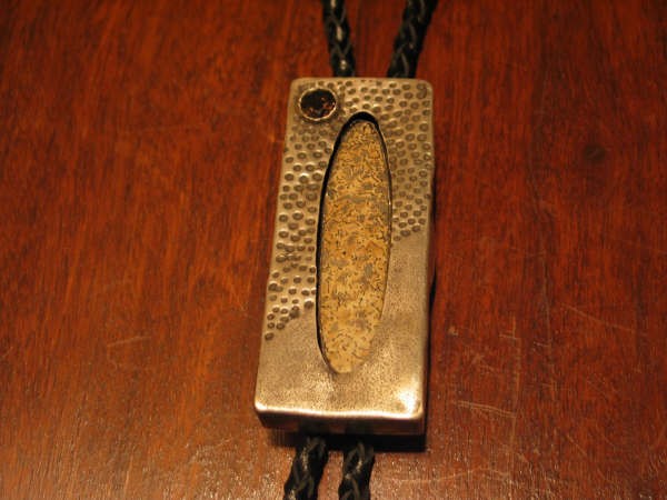 Sterling bolo tie w/petrified dinosaurs bone 