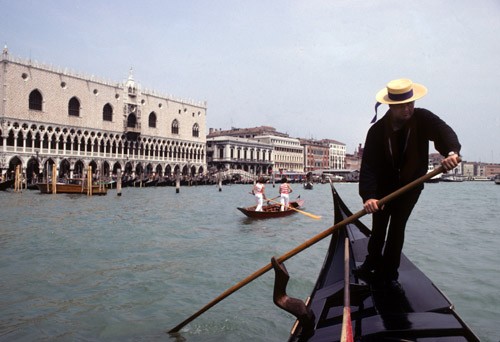 Gondolier on Grand Canal, Venice, Italy