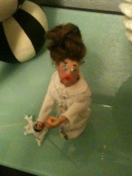 Lady w beehive hair w mop in robe