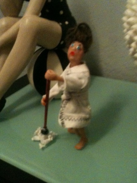 Lady w beehive hairdo in robe w mop