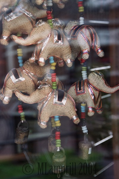 Elephants hanging in a shop window