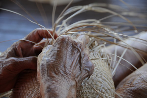 The hands of a master weaver.