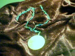 wire work and beads with mother of pearl pendant