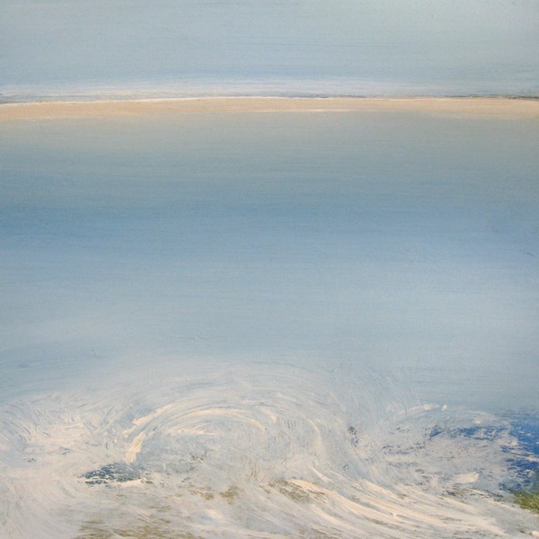 The sea touching the coast on a hazy day