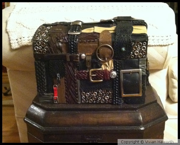 SMALL TRUNK COLLAGED WITH LEATHER PIECES
