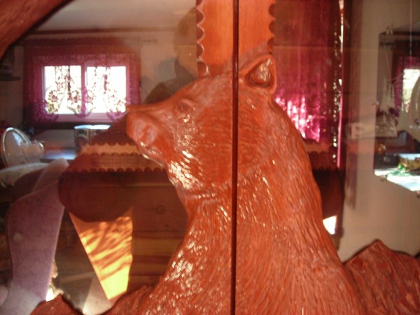 closeup of the hand carved bear cabinet